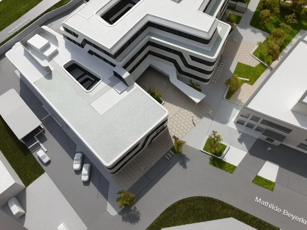 Architekturmodell eines Bürokomplexes mit moderner Fassade, Innenhof und detaillierter Straßenumgebung.