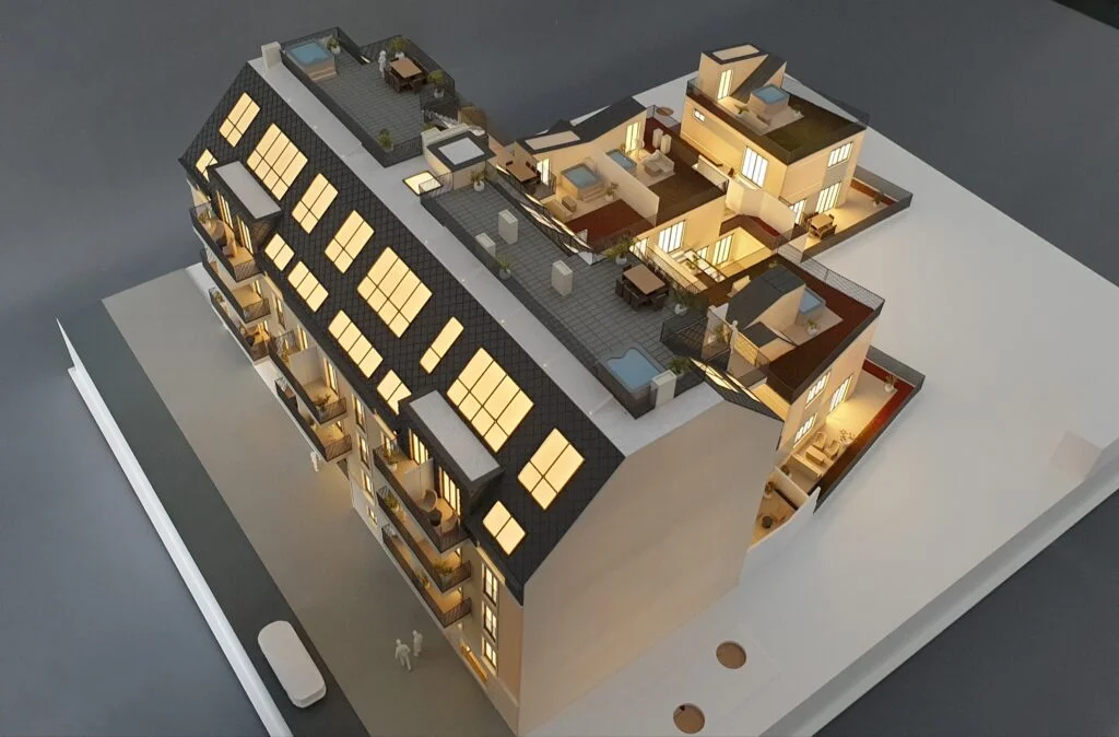 Immobilienmodell mit Dachterrassen und Grünflächen – Präsentationsmodell im Maßstab 1:200, moderne Architektur mit klarer Formensprache.