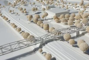 Weißes Umgebungsmodell mit Fußgängerbrücke, topografischen Linien und heller Baumstruktur.