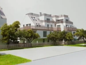 Moderne Wohnanlage mit terrassierten Balkonen, hellen Fassaden und begrüntem Außenbereich – Architekturmodell