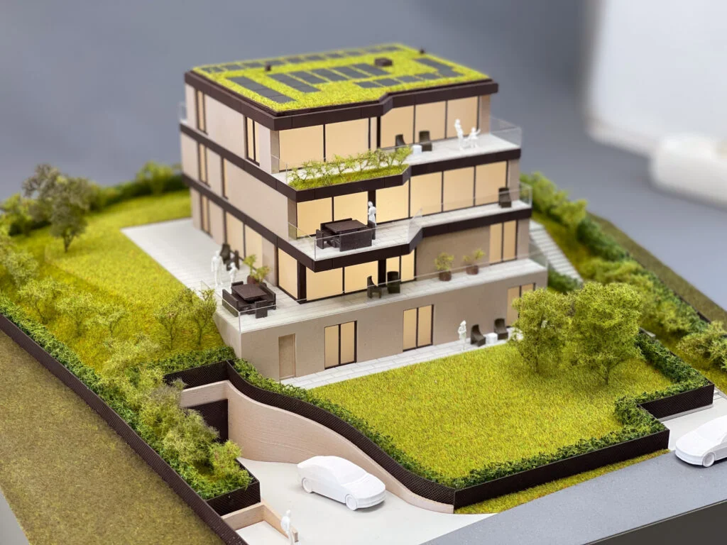 Detailliertes Präsentationsmodell einer Villa mit Gartenanlage und realistischer Texturierung.